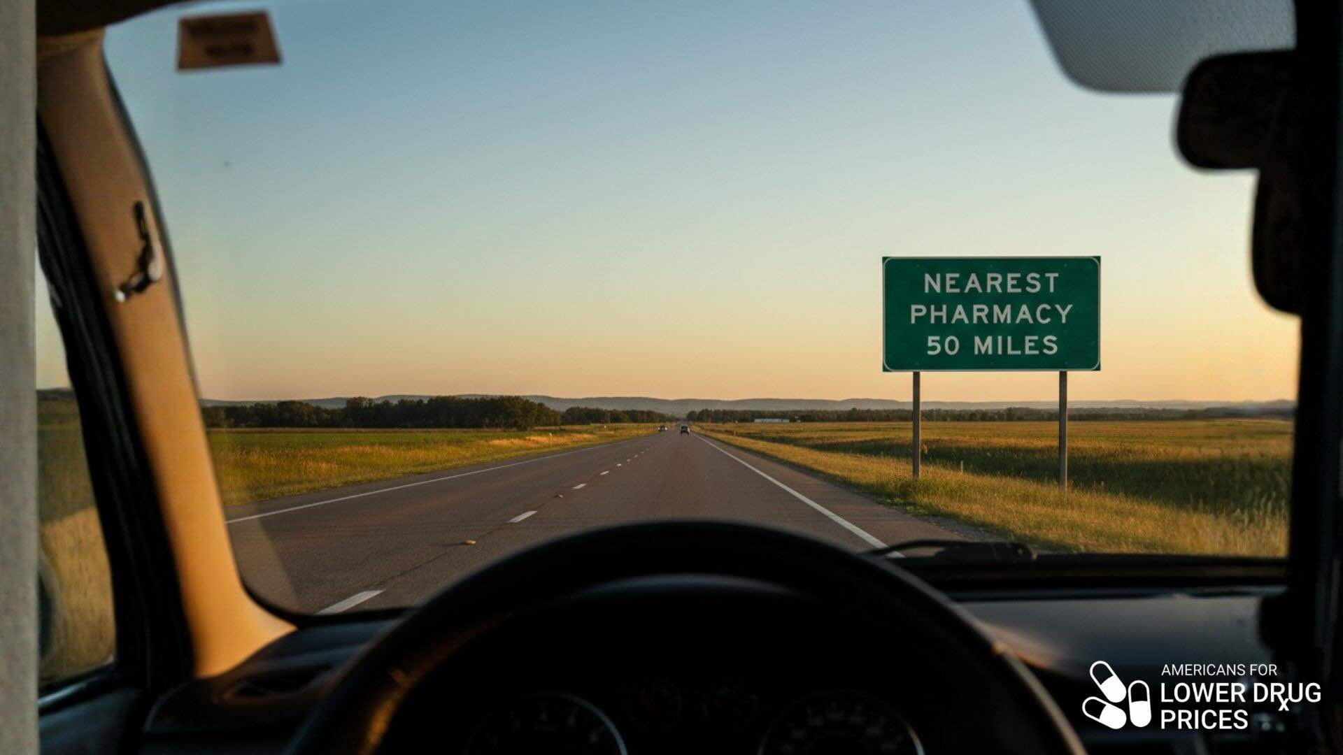 country road with sign 'Next Pharmacy 50 Miles'
